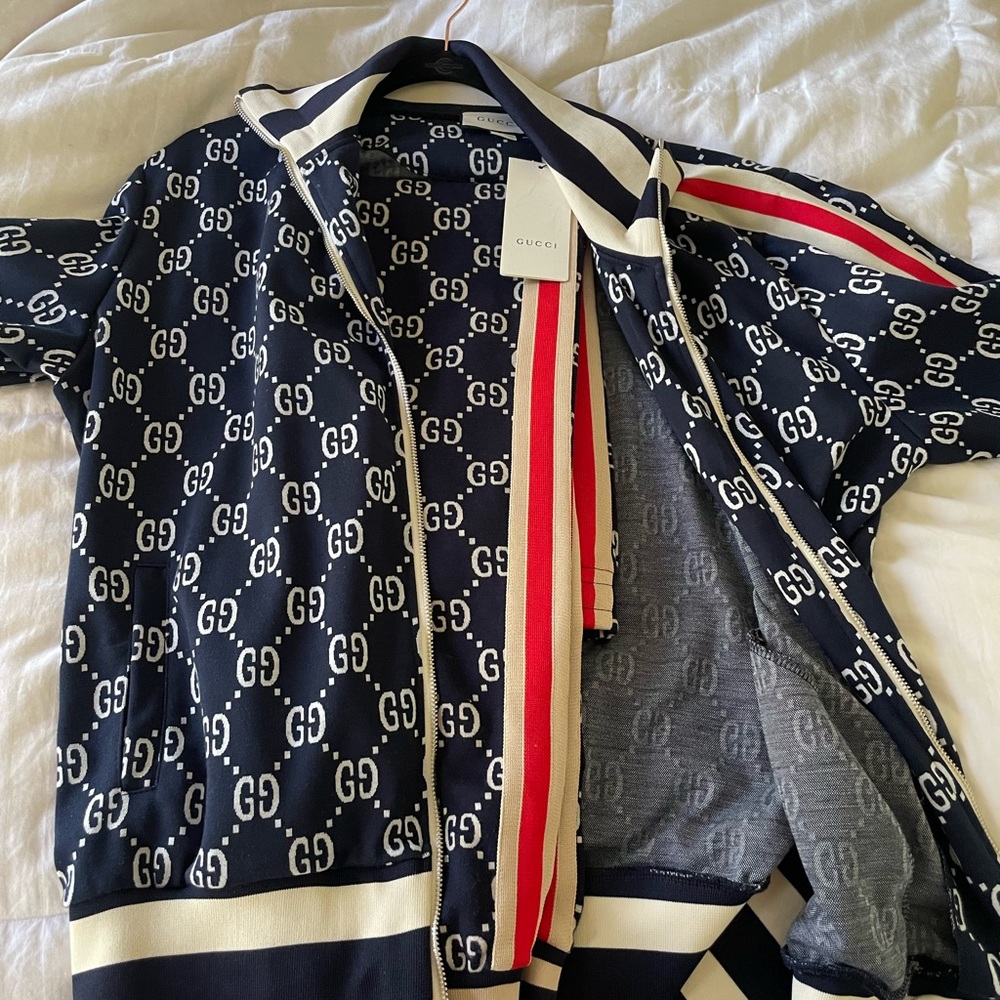 Authentic men/woman Gucci tracksuit jacket and pants , jacket XL , pants L.
